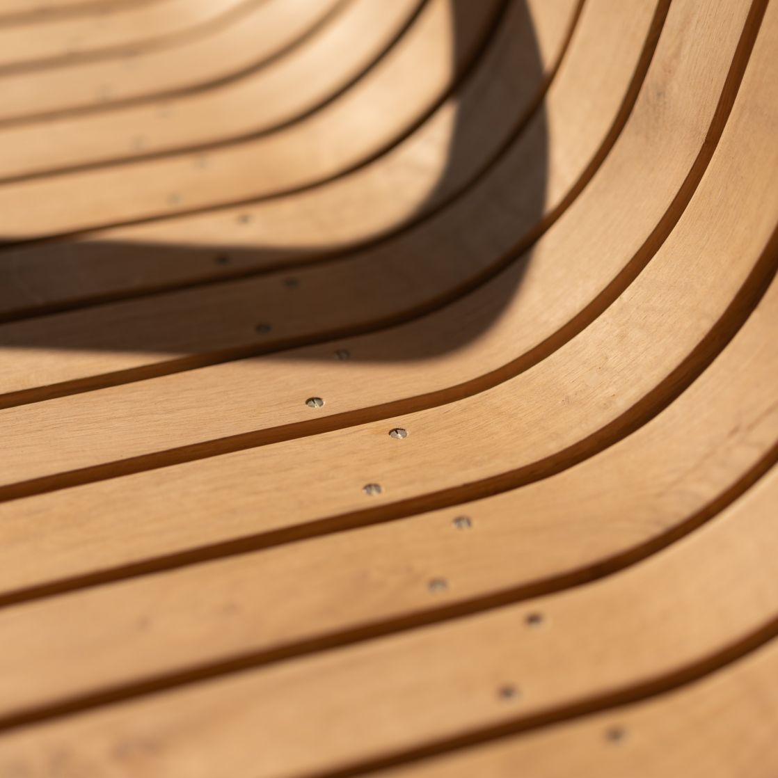 Steam bent oak slats of outdoor chair