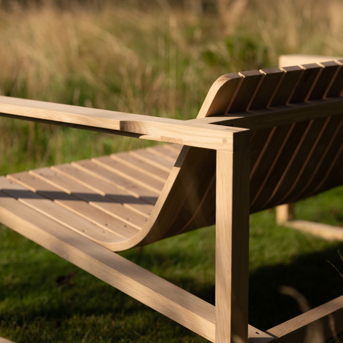 Steam bent double seater garden chair side profile