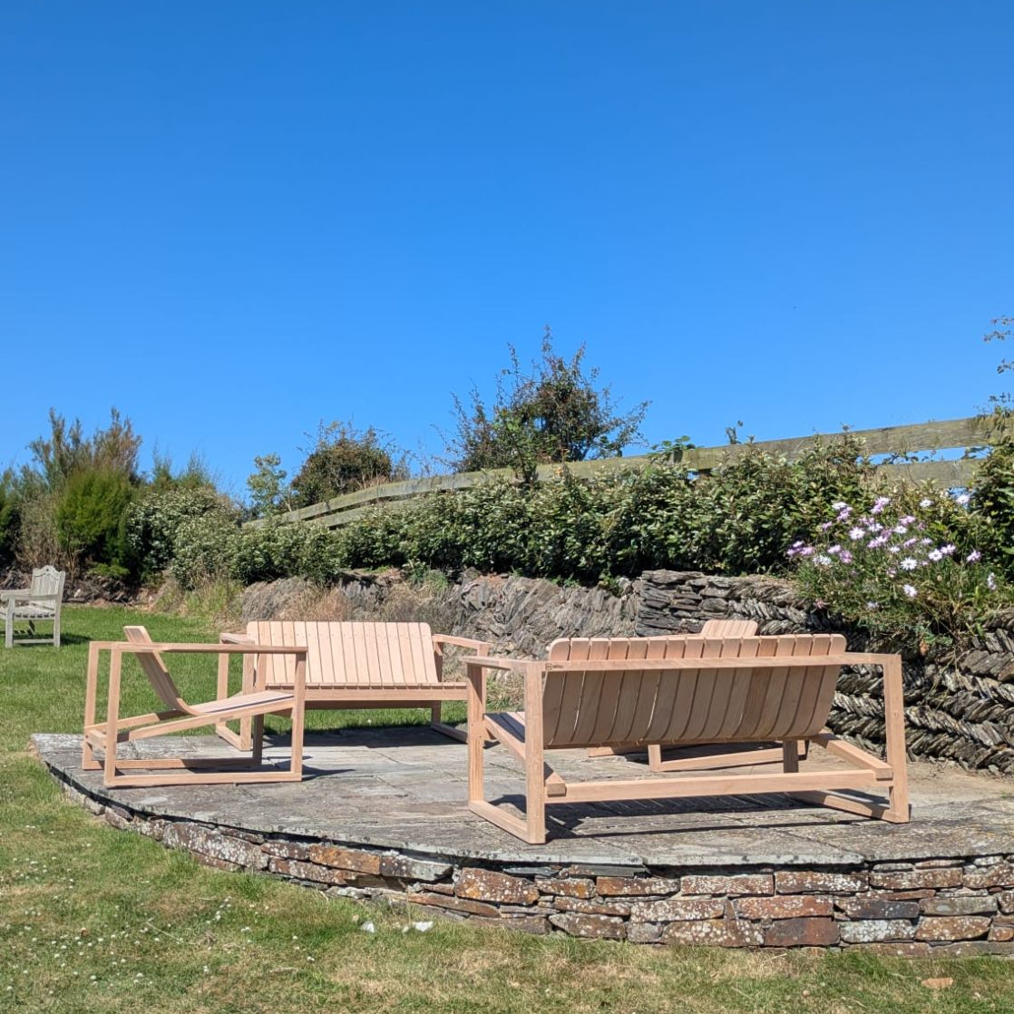 Set of outdoor chairs with a mix of single and two seaters made from sustainable European oak