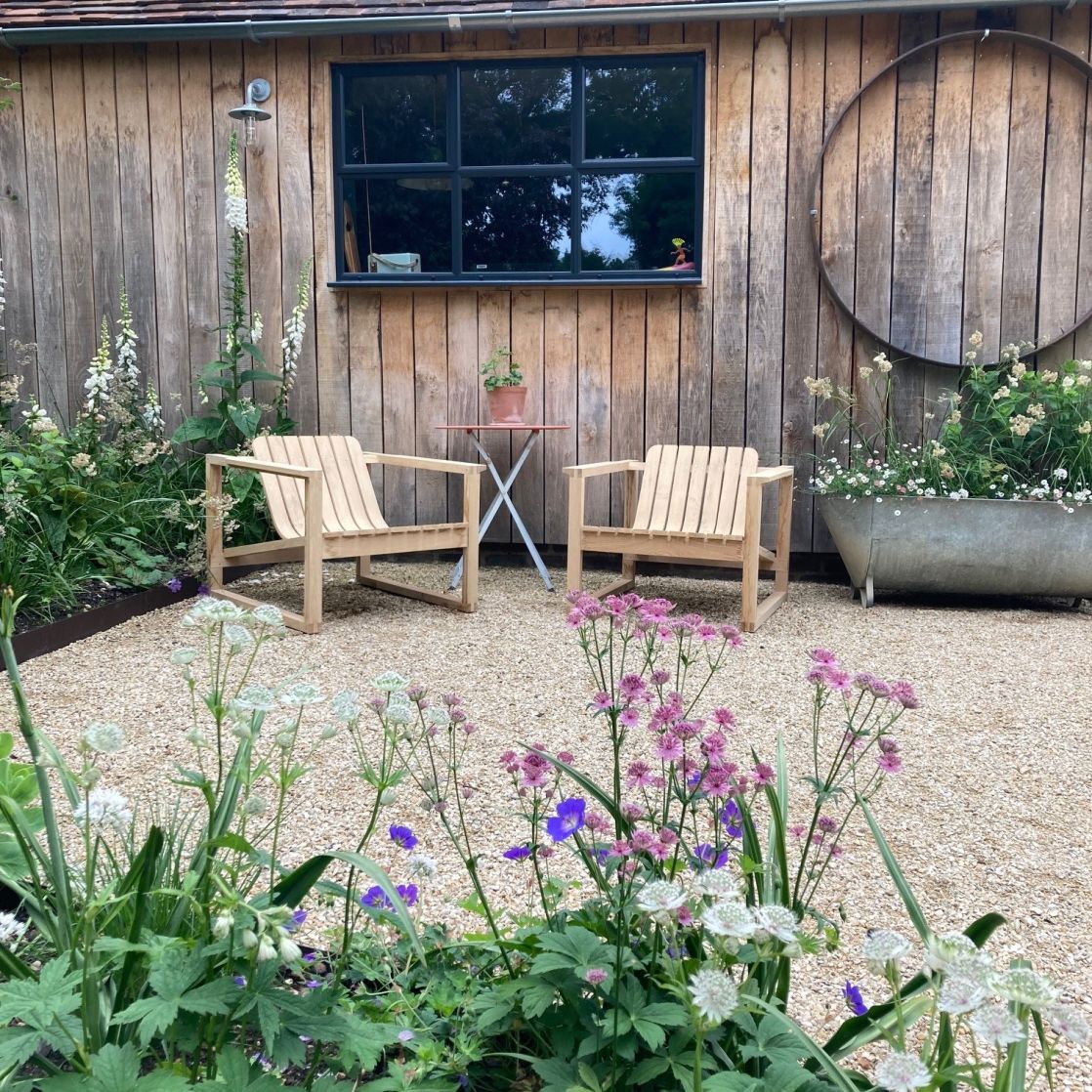 Steam bent Huers Chairs in stylish outdoor garden
