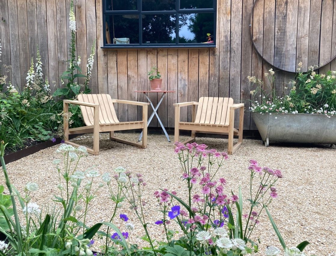 Steam bent Huers Chairs in stylish outdoor garden