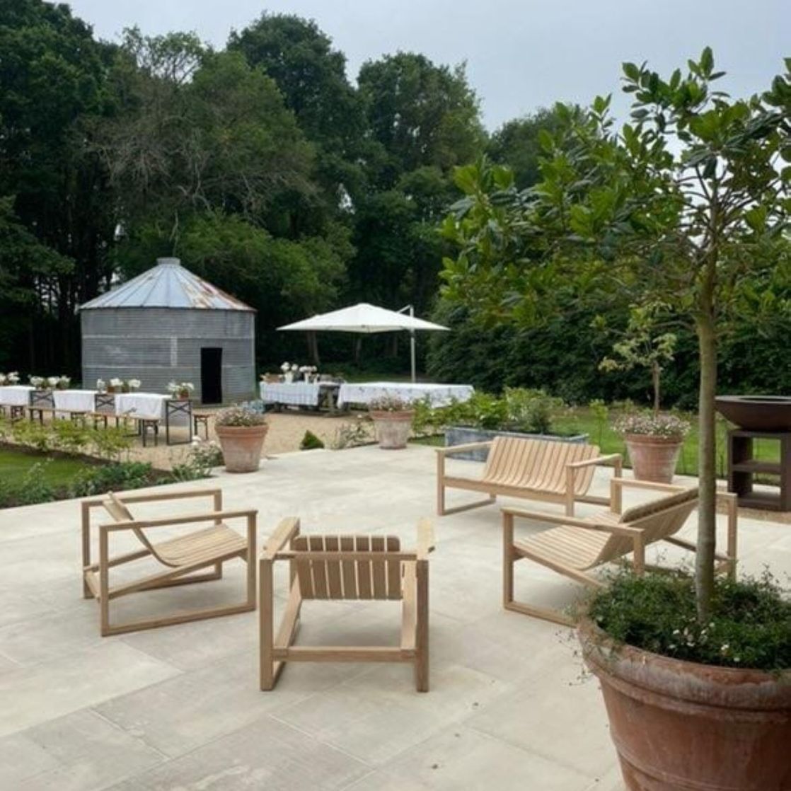 Set of steam bent Huers Chairs on patio including side profile showing sleek contemporary lines