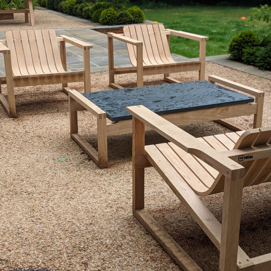 Set of Huers Chairs and Long Huers Table showing modern slate design