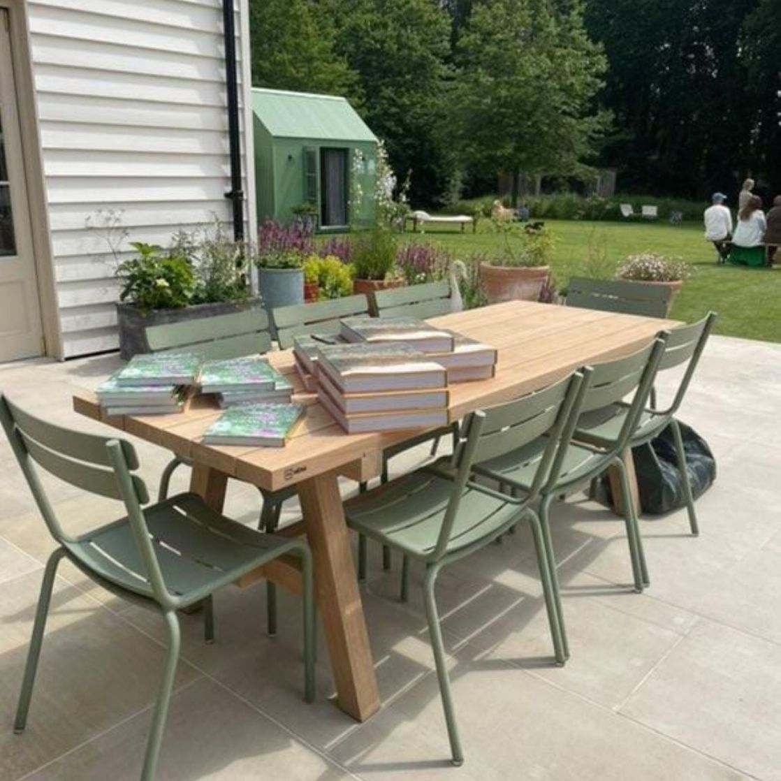 Contemporary mix and match oak Prenn dining table with stylish green Fermob chairs