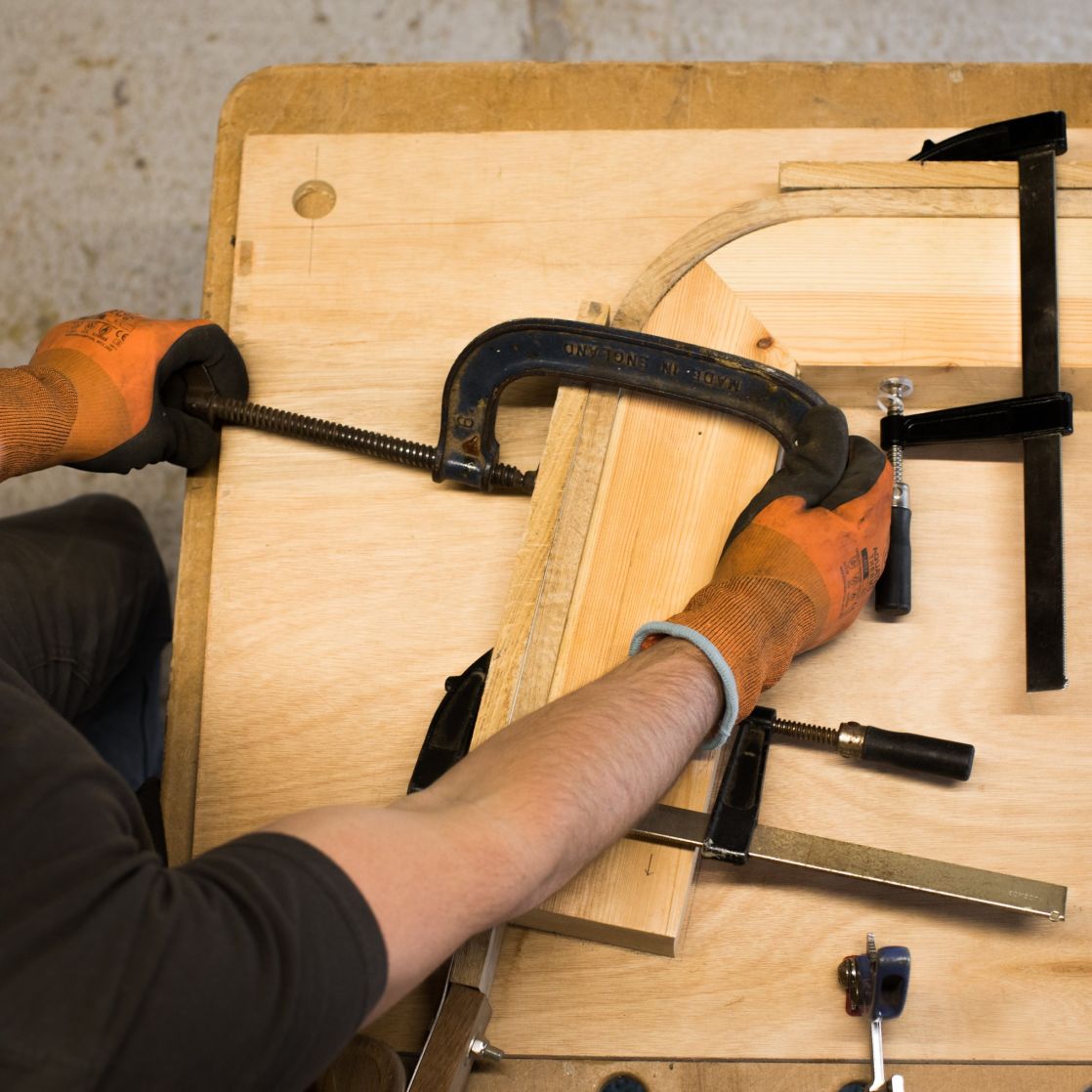 Shaping steam bent oak slat using jig